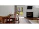 Cozy dining area featuring sliding door access to the backyard and a fireplace at 11 Stone Village, Durham, NC 27704