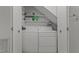 Bright laundry area equipped with washer, dryer, storage shelves, and organized space at 11 Stone Village, Durham, NC 27704
