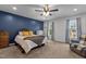 Charming main bedroom features large windows for natural light at 11 Stone Village, Durham, NC 27704