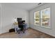 Bright home office with large windows and neutral walls, great for working at home at 11 Stone Village, Durham, NC 27704