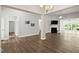 Spacious open-concept living area with hardwood floors and fireplace at 11 Woodwater Cir, Lillington, NC 27546