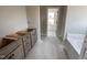 Bathroom featuring a new tub and vanity with drawers and doors, perfect for everyday use at 112 Royal Ave, Selma, NC 27576