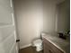 Modern bathroom features granite countertops, wood cabinets, and sleek fixtures at 112 Royal Ave, Selma, NC 27576
