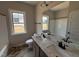 Bathroom featuring a double vanity, a shower, and a bath. Lots of light with 2 windows at 112 Royal Ave, Selma, NC 27576