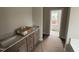 Bathroom featuring double sinks, granite countertop and tile flooring at 112 Royal Ave, Selma, NC 27576