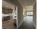 Hallway view of an open-concept home showing the kitchen and living room at 112 Royal Ave, Selma, NC 27576