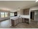 A partial view of a kitchen featuring granite countertops and stainless faucet and sink at 112 Royal Ave, Selma, NC 27576