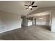 Spacious living room with vaulted ceiling, ceiling fan, and wood-look flooring at 112 Royal Ave, Selma, NC 27576