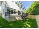 Large deck area accessible from the backyard overlooking a green lawn with a wooden fence at 1124 Upchurch St, Raleigh, NC 27610
