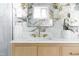 Bright bathroom featuring gold hardware, large marble mirror, and walk-in shower at 1124 Upchurch St, Raleigh, NC 27610