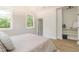 Bright bedroom featuring light walls, wood floors, and built-in shelves for optimal storage at 1124 Upchurch St, Raleigh, NC 27610