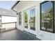 An outside view of the glass door entrance from the porch at 1124 Upchurch St, Raleigh, NC 27610
