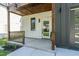 Charming front porch featuring wood trim and a covered entryway. Address '1124' prominently displayed at 1124 Upchurch St, Raleigh, NC 27610