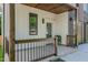 Inviting front porch with wood accents and a covered entryway. Address '1124' clearly displayed at 1124 Upchurch St, Raleigh, NC 27610