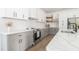 A modern kitchen with stainless steel appliances and white countertops at 1124 Upchurch St, Raleigh, NC 27610