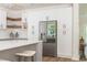 Spacious kitchen featuring white cabinets, modern stainless steel appliances, and counter seating at 1124 Upchurch St, Raleigh, NC 27610