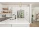 Kitchen featuring an island with white countertop and modern cabinetry at 1124 Upchurch St, Raleigh, NC 27610