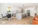 Bright kitchen featuring a large island, modern stainless steel appliances, and a casual dining area at 1124 Upchurch St, Raleigh, NC 27610