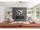 Cozy living area showcasing a fireplace, built-in shelves, and stylish decor for a relaxing ambiance at 1124 Upchurch St, Raleigh, NC 27610