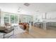 Open-concept living space flowing into the kitchen area, featuring natural light and modern finishes at 1124 Upchurch St, Raleigh, NC 27610