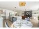 Open-concept living room, dining area, and kitchen with an island at 1124 Upchurch St, Raleigh, NC 27610