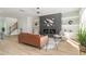 Comfortable living room features a fireplace, soft seating, and view into staircase at 1124 Upchurch St, Raleigh, NC 27610