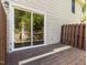This back deck features a sliding glass door at 113 Weatherstone Dr # B, Chapel Hill, NC 27514
