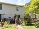 A view of the home's backyard showing a deck and sliding glass doors at 113 Weatherstone Dr # B, Chapel Hill, NC 27514