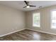 This bedroom features wood-look floors and two windows providing plenty of natural light at 113 Weatherstone Dr # B, Chapel Hill, NC 27514