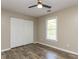 This bedroom offers wood-look floors, closet and a window offering plenty of natural light at 113 Weatherstone Dr # B, Chapel Hill, NC 27514