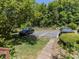 The parking area showing two vehicles parked on the side of the property at 113 Weatherstone Dr # B, Chapel Hill, NC 27514