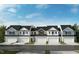 New townhomes featuring attached garages, neutral paint scheme and modern architectural details at 120 Malbec Dr, Chapel Hill, NC 27516