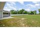 Expansive backyard featuring a screened porch, a fence and mature trees at `120 Red Hawk Pl, Smithfield, NC 27577