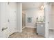 Beautiful bathroom featuring stylish vanity, framed mirror, tiled flooring and a glass-enclosed shower at `120 Red Hawk Pl, Smithfield, NC 27577