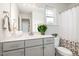 Bathroom featuring stylish vanity, framed mirror, and a shower-tub combo at `120 Red Hawk Pl, Smithfield, NC 27577