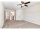 Bedroom features a ceiling fan, access to the main bathroom, and a walk-in closet at `120 Red Hawk Pl, Smithfield, NC 27577