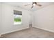 Bedroom with a ceiling fan and a large window and walk-in closet at `120 Red Hawk Pl, Smithfield, NC 27577