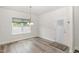 Cozy dining area with a view of the backyard and a glass-paned door to the outside at `120 Red Hawk Pl, Smithfield, NC 27577