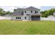 View of the home's siding, screened in porch, and backyard at `120 Red Hawk Pl, Smithfield, NC 27577