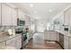 Modern kitchen with stainless steel appliances, gray cabinetry, and granite countertops at `120 Red Hawk Pl, Smithfield, NC 27577