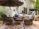 Outdoor deck with wicker furniture and umbrella, perfect for relaxation at 1204 Benoit Pl, Apex, NC 27502