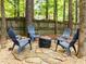 Backyard with fire pit and Adirondack chairs, perfect for outdoor entertaining at 1204 Benoit Pl, Apex, NC 27502