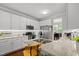Kitchen featuring granite countertops, stainless steel appliances, and breakfast bar at 1204 Benoit Pl, Apex, NC 27502