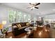 Bright living room featuring hardwood floors, natural light and views at 1204 Benoit Pl, Apex, NC 27502