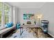 Bright and airy home office with a comfortable bench, stylish desk, and colorful decor at 1204 Benoit Pl, Apex, NC 27502