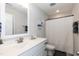 Bathroom featuring white vanity and countertops, a shower with a white curtain, and modern fixtures at 1223 Brown Velvet Ln, Apex, NC 27523