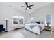 Bedroom with a vaulted ceiling, ample natural light, modern fan, and neutral decor at 1223 Brown Velvet Ln, Apex, NC 27523