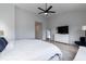 Bedroom featuring a vaulted ceiling, large windows, modern fan, and neutral decor at 1223 Brown Velvet Ln, Apex, NC 27523