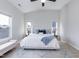 Bright bedroom with vaulted ceiling, large windows, a ceiling fan, and neutral decor at 1223 Brown Velvet Ln, Apex, NC 27523