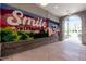Hallway mural with brick archway leading to the outdoors, and the community tagline 'You're in Sweetwater' at 1223 Brown Velvet Ln, Apex, NC 27523